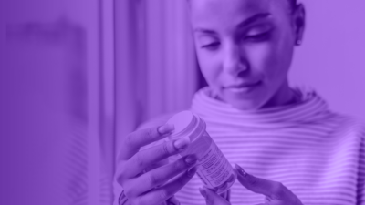 purple image of woman holding a prescription bottle.